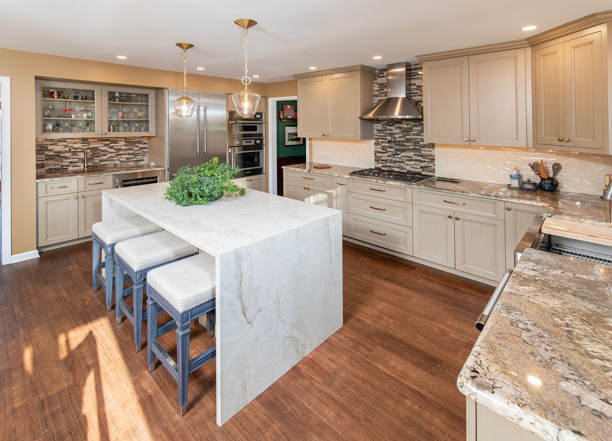 Luxurious kitchen with marble island and gold accents