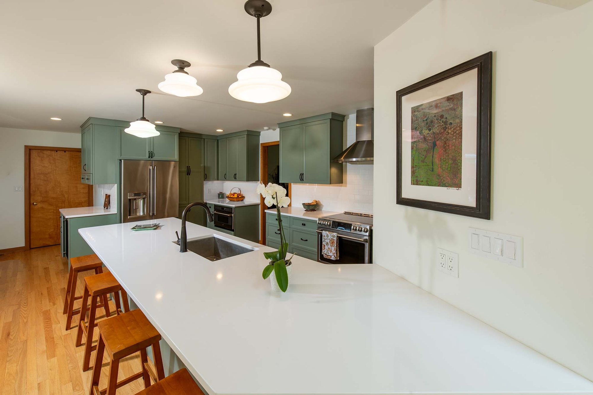 kitchen with large bar and orchid